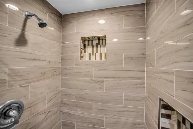 a view of a patio with table and chairs and potted plants