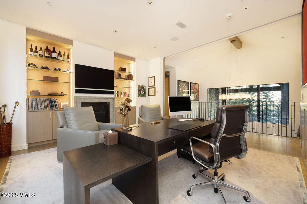 254 Beaver Dam Road Vail, CO 81657 - Photo 19 of 46 a view of a livingroom with workspace and a couch