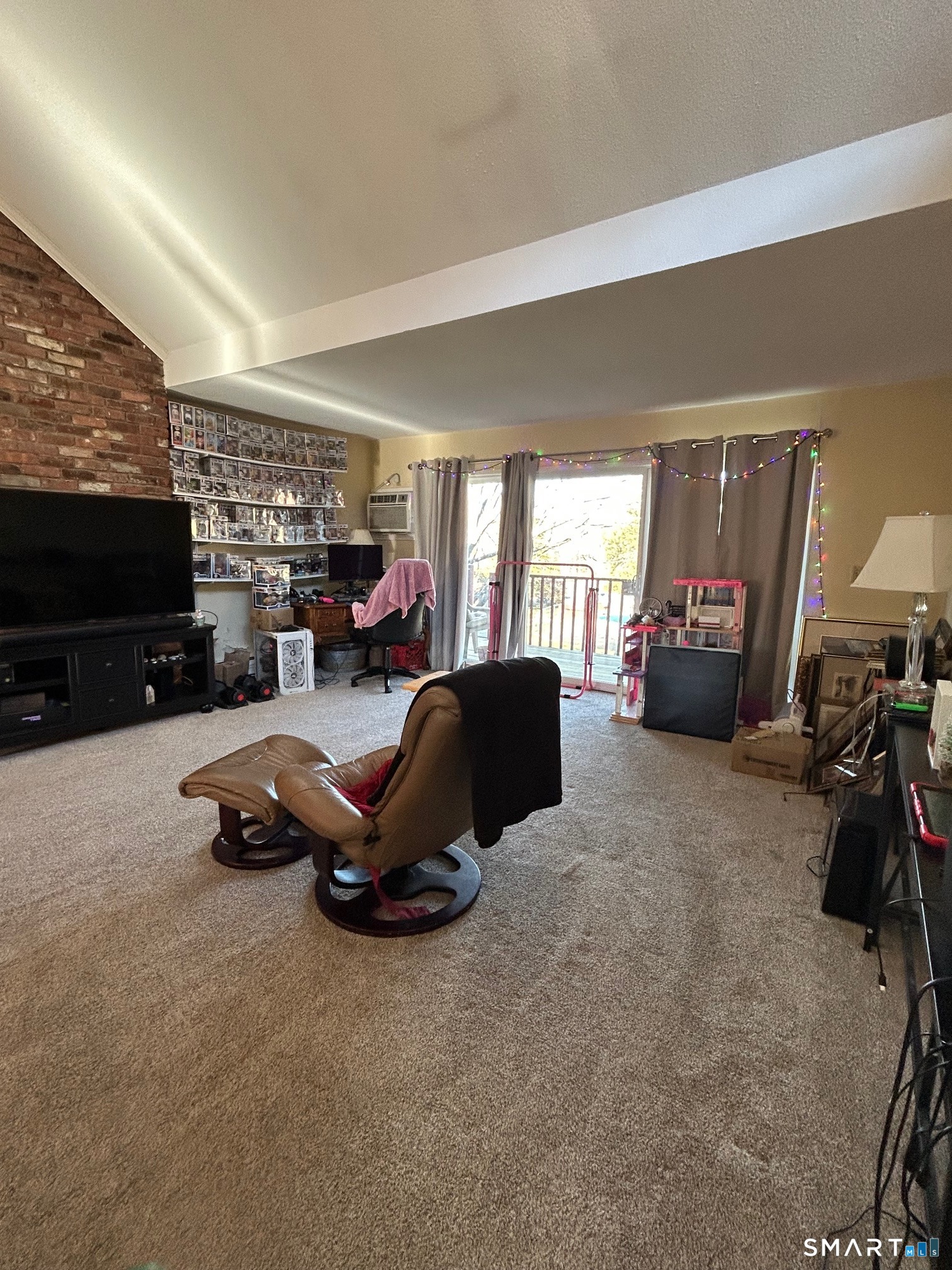 126 Sherman Hill Road, Unit B12 Woodbury, CT 06798 - Photo 11 of 27 a view of a livingroom with furniture and a flat screen tv