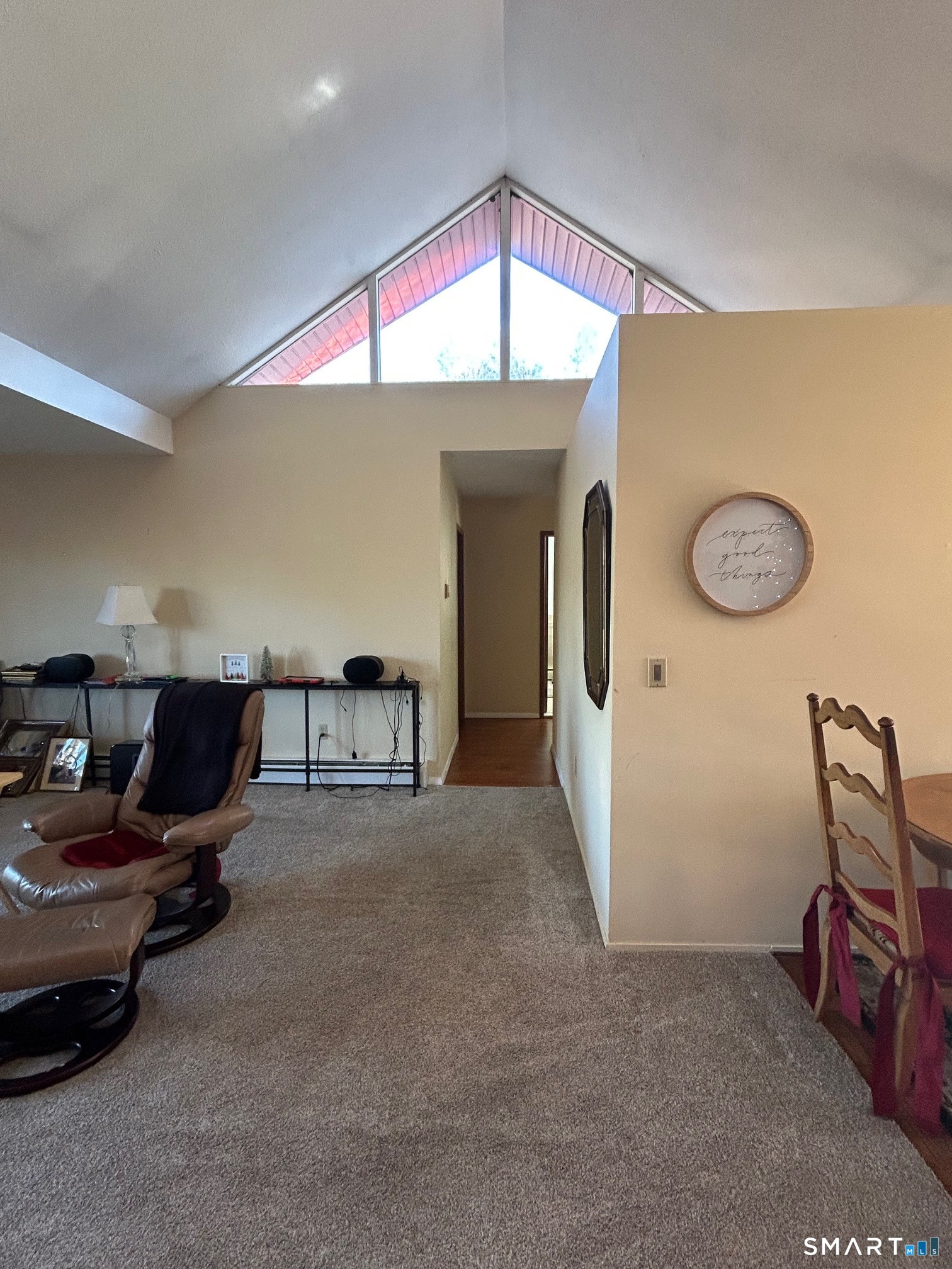 126 Sherman Hill Road, Unit B12 Woodbury, CT 06798 - Photo 12 of 27 a living room with furniture a air conditioner vent and a window