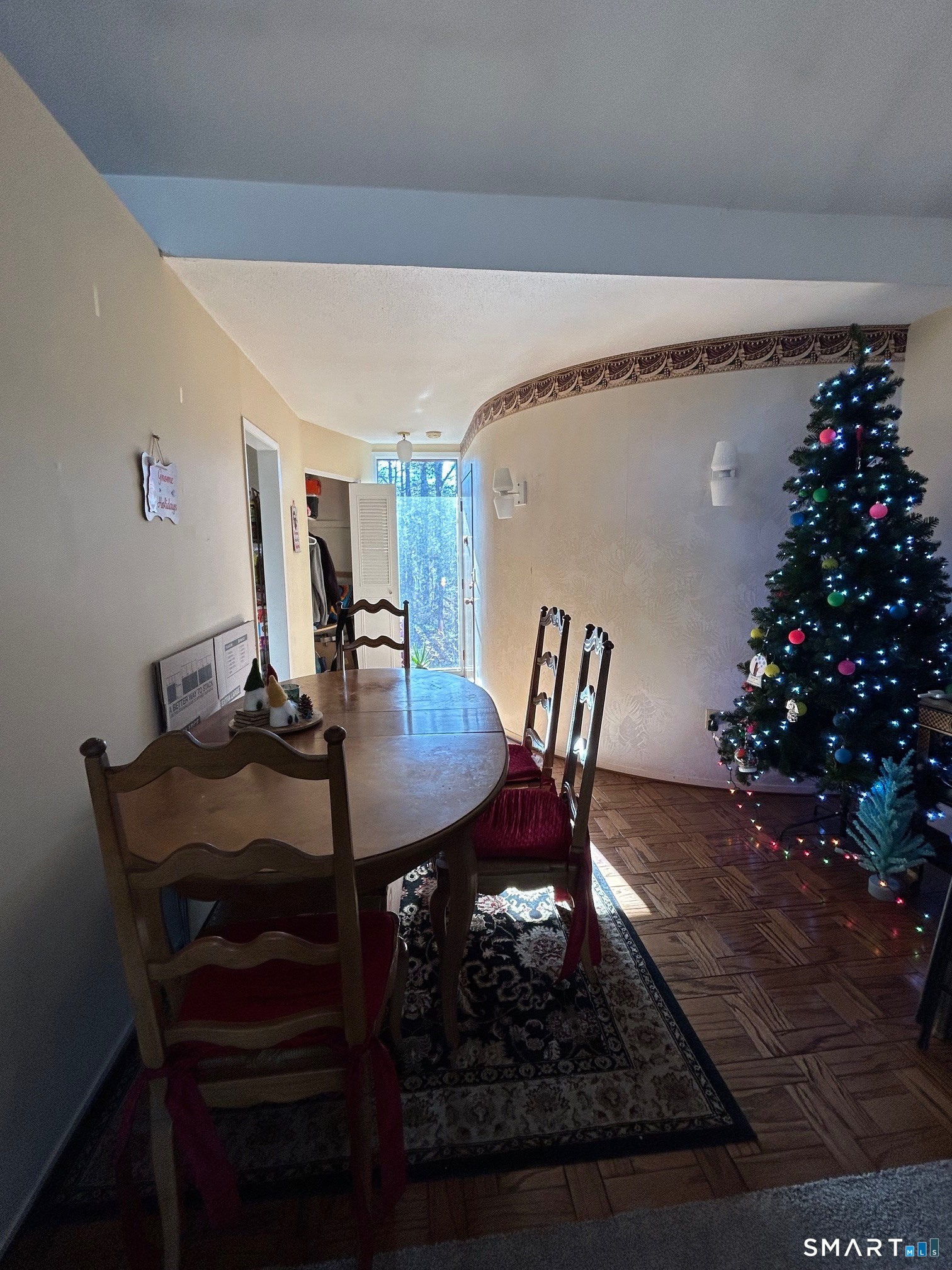 126 Sherman Hill Road, Unit B12 Woodbury, CT 06798 - Photo 13 of 27 a view of a dining room with furniture and wooden floor