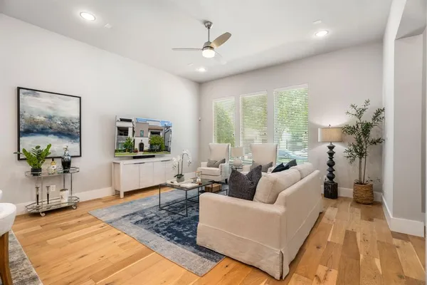 a living room with furniture and a large window