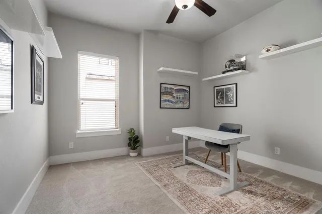 a work room with furniture and windows