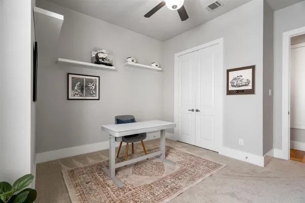 a view of a workspace with furniture