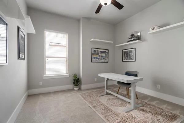 a work room with furniture and windows