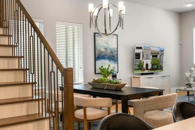 a dining room with furniture and window