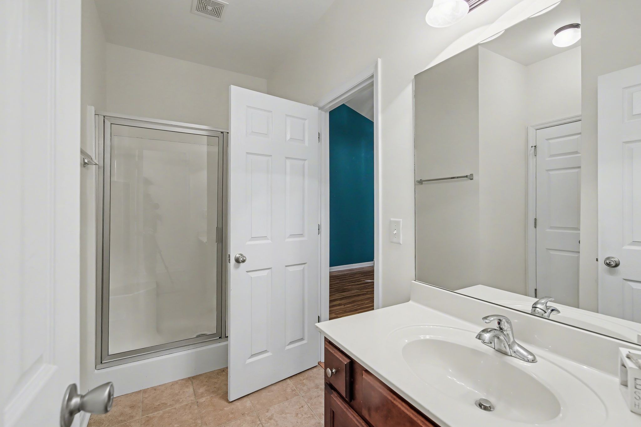 2521 Pennington Bend Road, Unit 211 Nashville, TN 37214 - Photo 14 of 21 a bathroom with a sink and a mirror