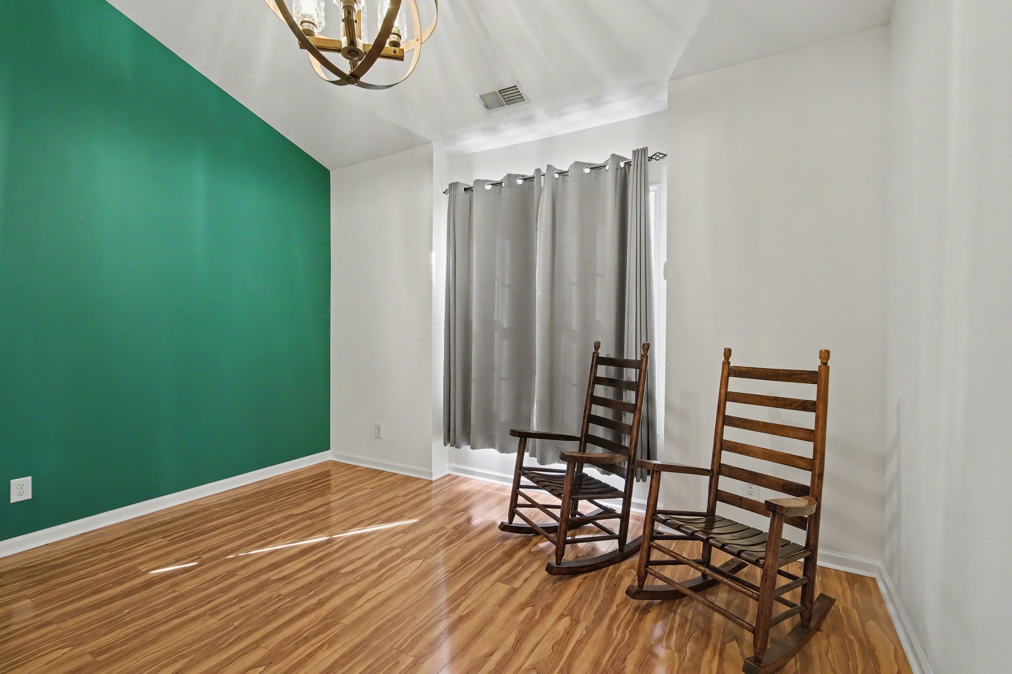 2521 Pennington Bend Road, Unit 211 Nashville, TN 37214 - Photo 15 of 21 a view of a room with wooden floor and windows