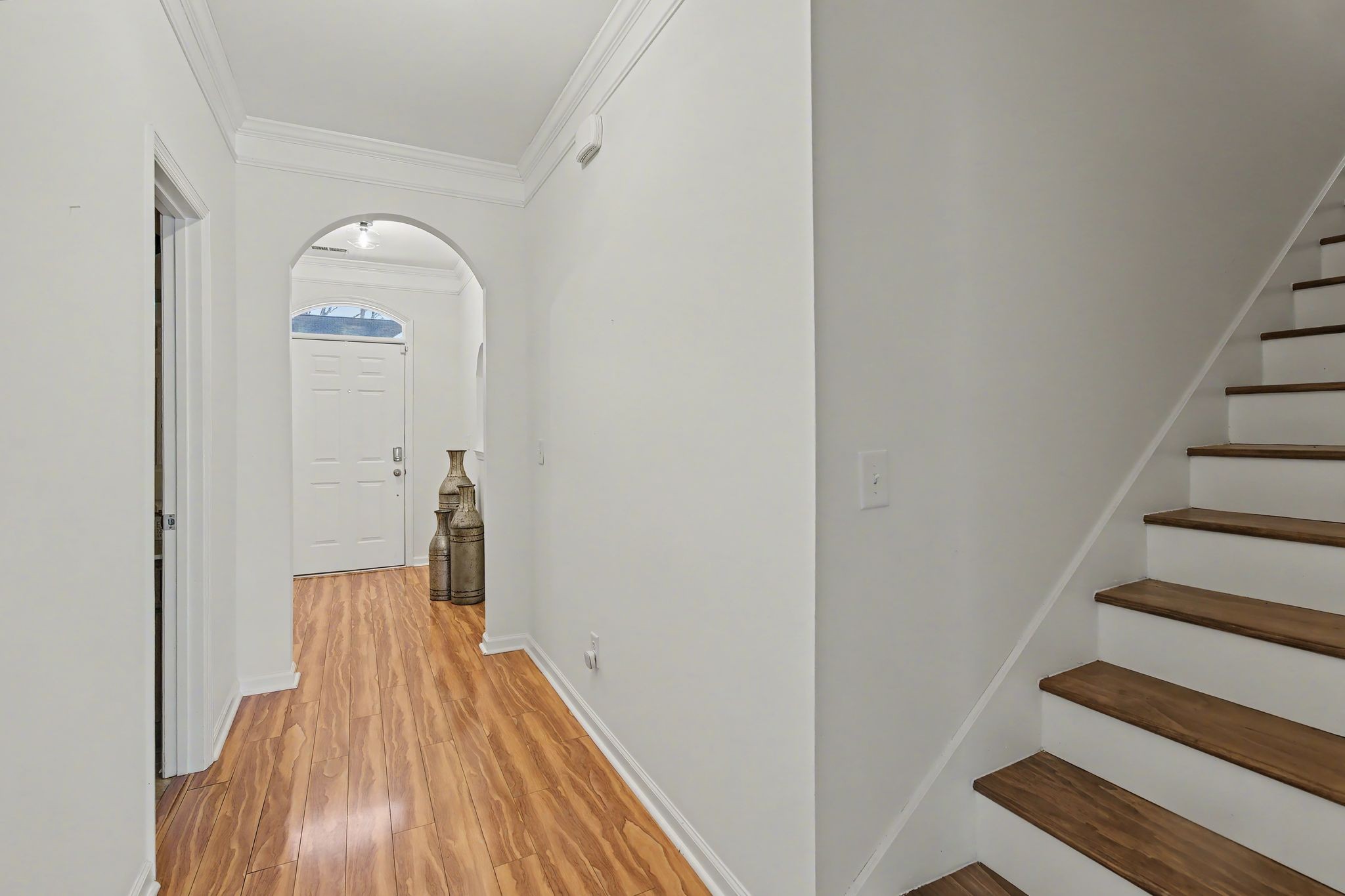 2521 Pennington Bend Road, Unit 211 Nashville, TN 37214 - Photo 18 of 21 a view of a hallway with wooden floor and staircase