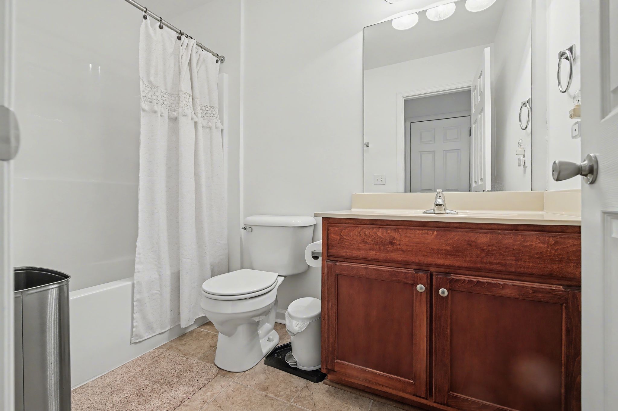 2521 Pennington Bend Road, Unit 211 Nashville, TN 37214 - Photo 21 of 21 a bathroom with a toilet a sink and a mirror