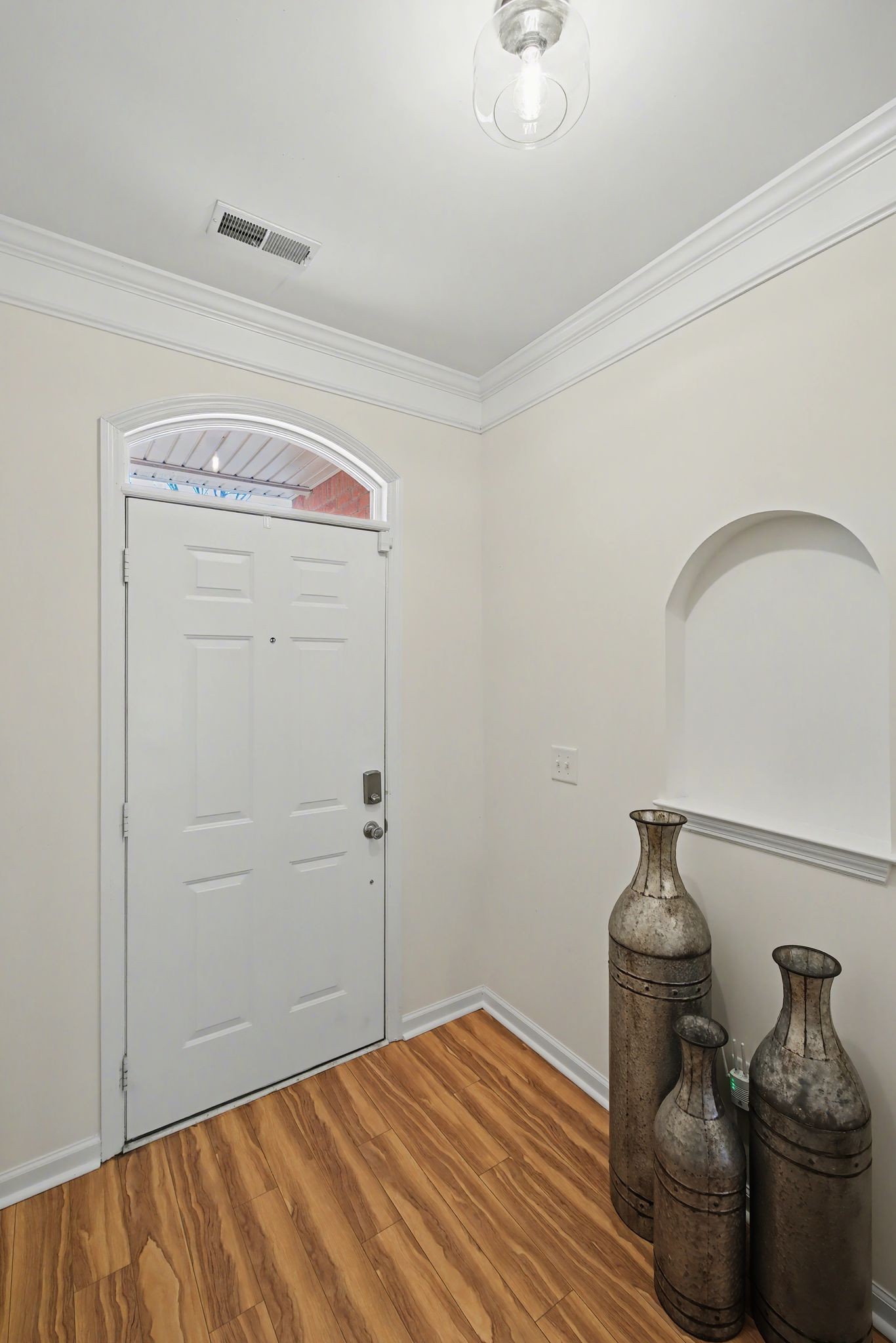 2521 Pennington Bend Road, Unit 211 Nashville, TN 37214 - Photo 4 of 21 a bedroom with a bed and wooden floor