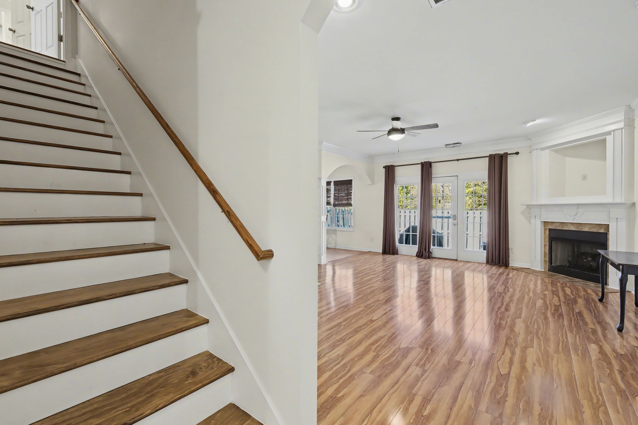 2521 Pennington Bend Road, Unit 211 Nashville, TN 37214 - Photo 5 of 21 a view of an empty room with wooden floor and a fireplace