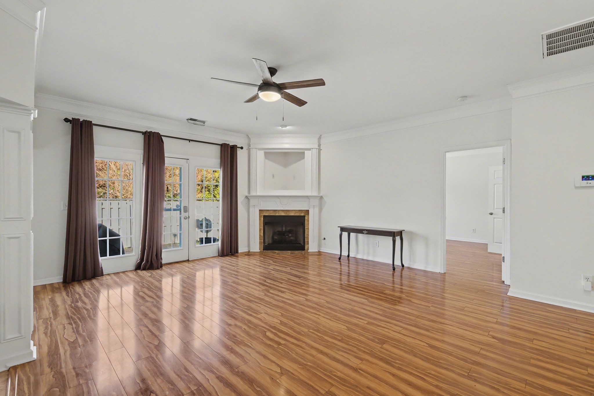 2521 Pennington Bend Road, Unit 211 Nashville, TN 37214 - Photo 6 of 21 a view of an empty room with window fireplace and wooden floor