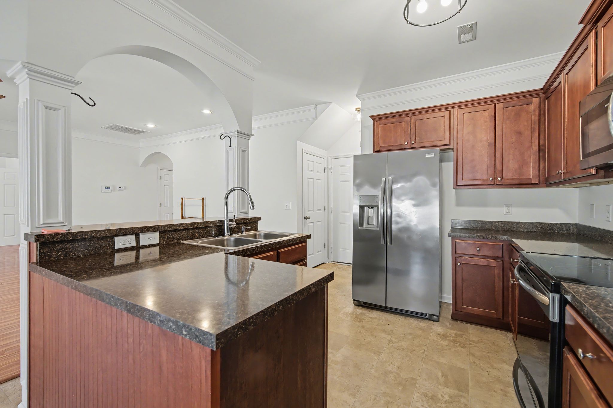 2521 Pennington Bend Road, Unit 211 Nashville, TN 37214 - Photo 9 of 21 a kitchen with granite countertop a sink stainless steel appliances and cabinets