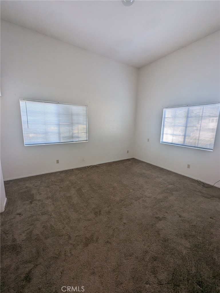 385 McCarthy Avenue, Unit D Oceano, CA 93445 - Photo 11 of 15 an empty room with windows