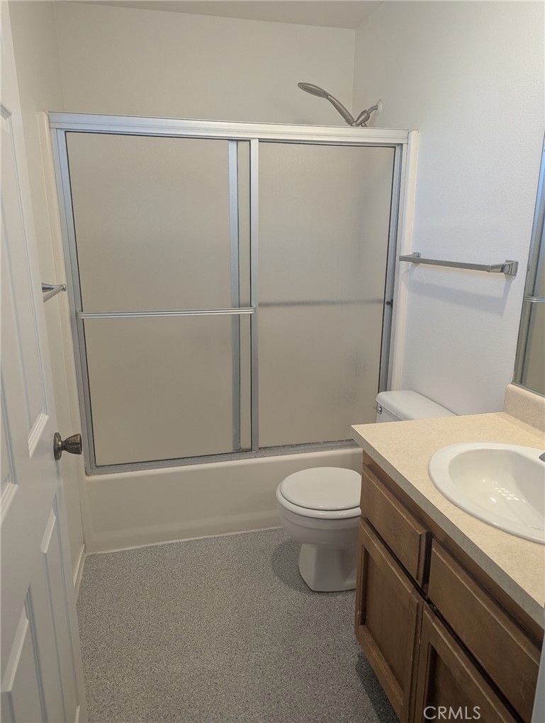 385 McCarthy Avenue, Unit D Oceano, CA 93445 - Photo 13 of 15 a white toilet sitting next to a bathroom sink