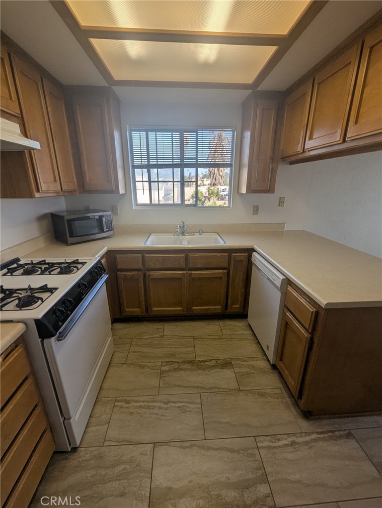 385 McCarthy Avenue, Unit D Oceano, CA 93445 - Photo 5 of 15 a kitchen with a stove sink and cabinets
