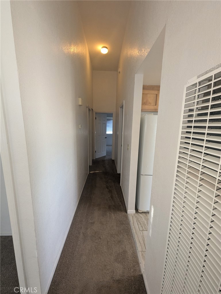 385 McCarthy Avenue, Unit D Oceano, CA 93445 - Photo 7 of 15 a view of a hallway with wooden floor