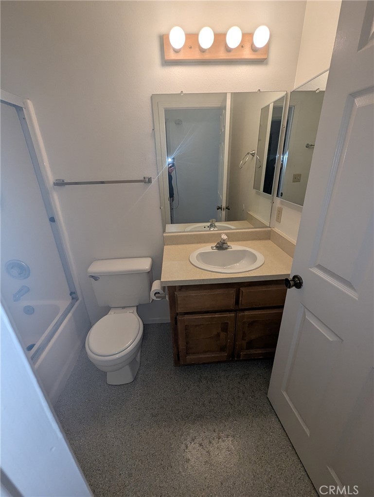 385 McCarthy Avenue, Unit D Oceano, CA 93445 - Photo 8 of 15 a bathroom with a sink a toilet and mirror