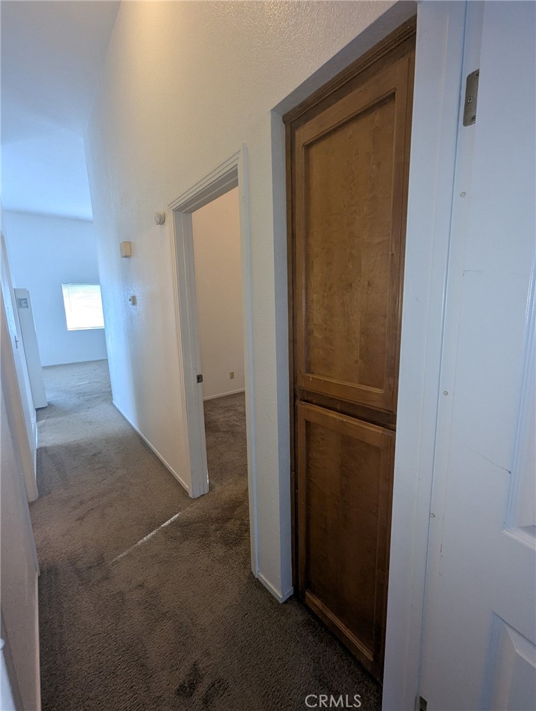 385 McCarthy Avenue, Unit D Oceano, CA 93445 - Photo 9 of 15 a view of a hallway with some storage