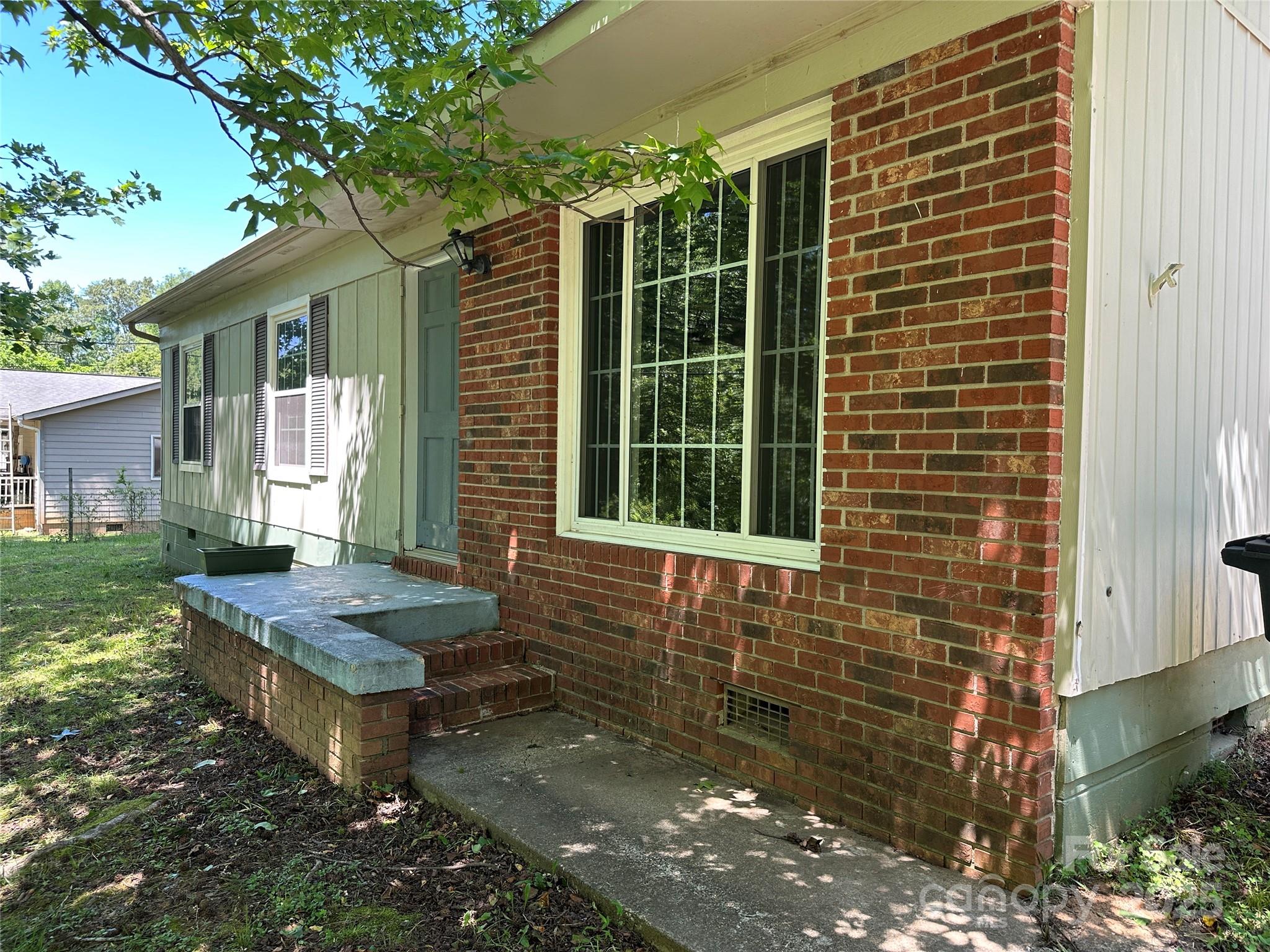488 John Swofford Road Nebo, NC 28761 - Photo 18 of 18 a backyard of a house with outdoor seating