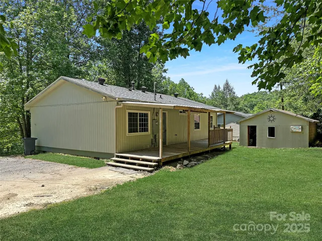 a view of a backyard of the house