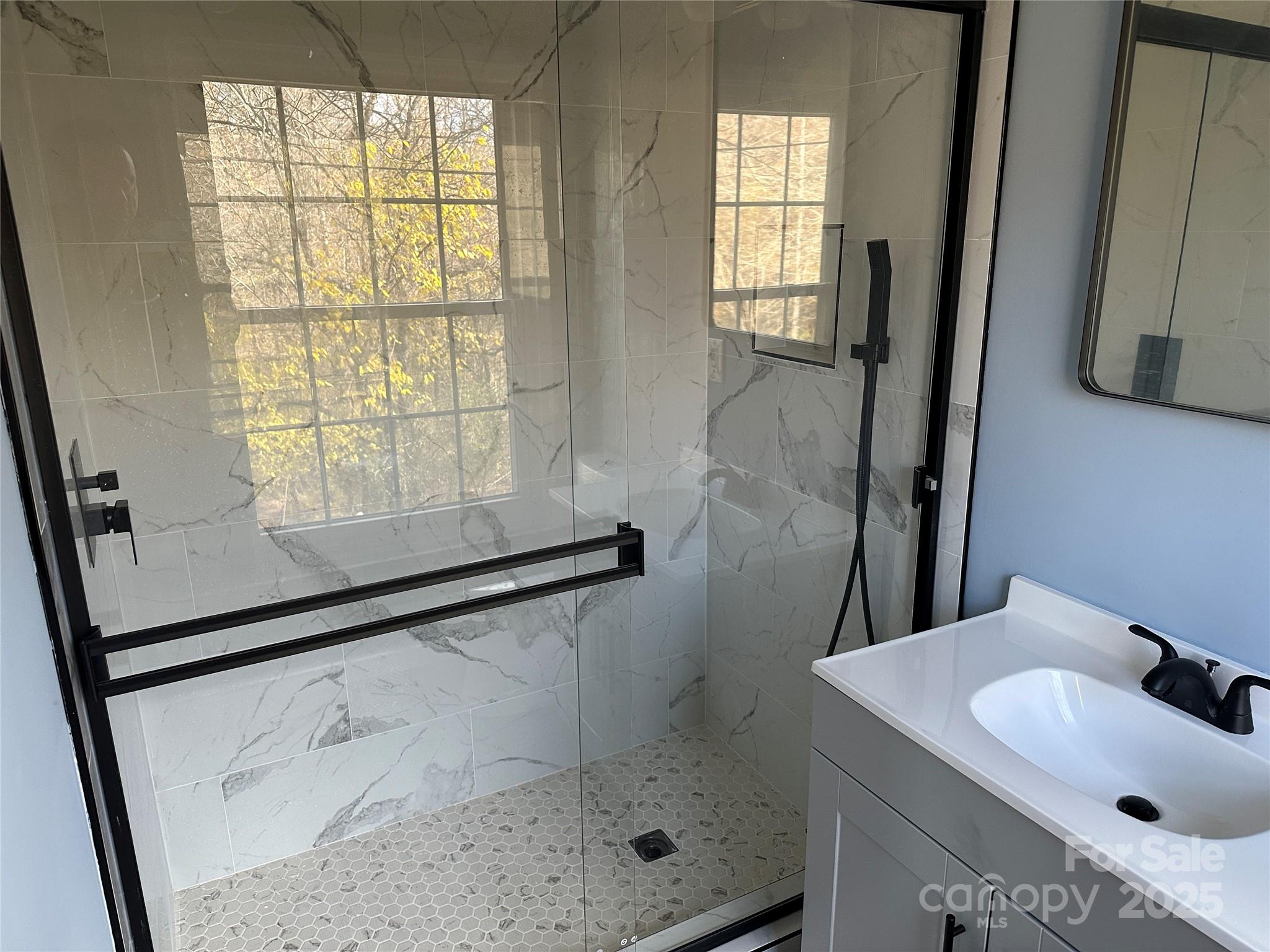 488 John Swofford Road Nebo, NC 28761 - Photo 10 of 18 a bathroom with a sink toilet and shower