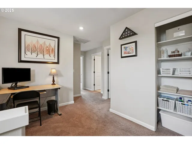 a view of a workspace with furniture