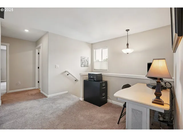 a kitchen with cabinets and wooden floor
