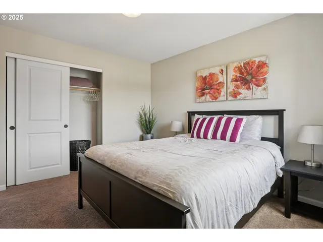 a bedroom with a large bed and a table