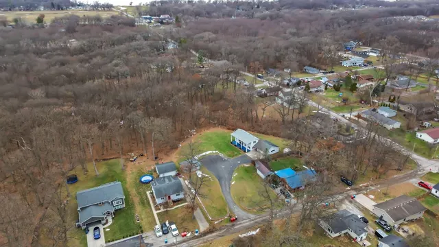 an aerial view of a house with outdoor space