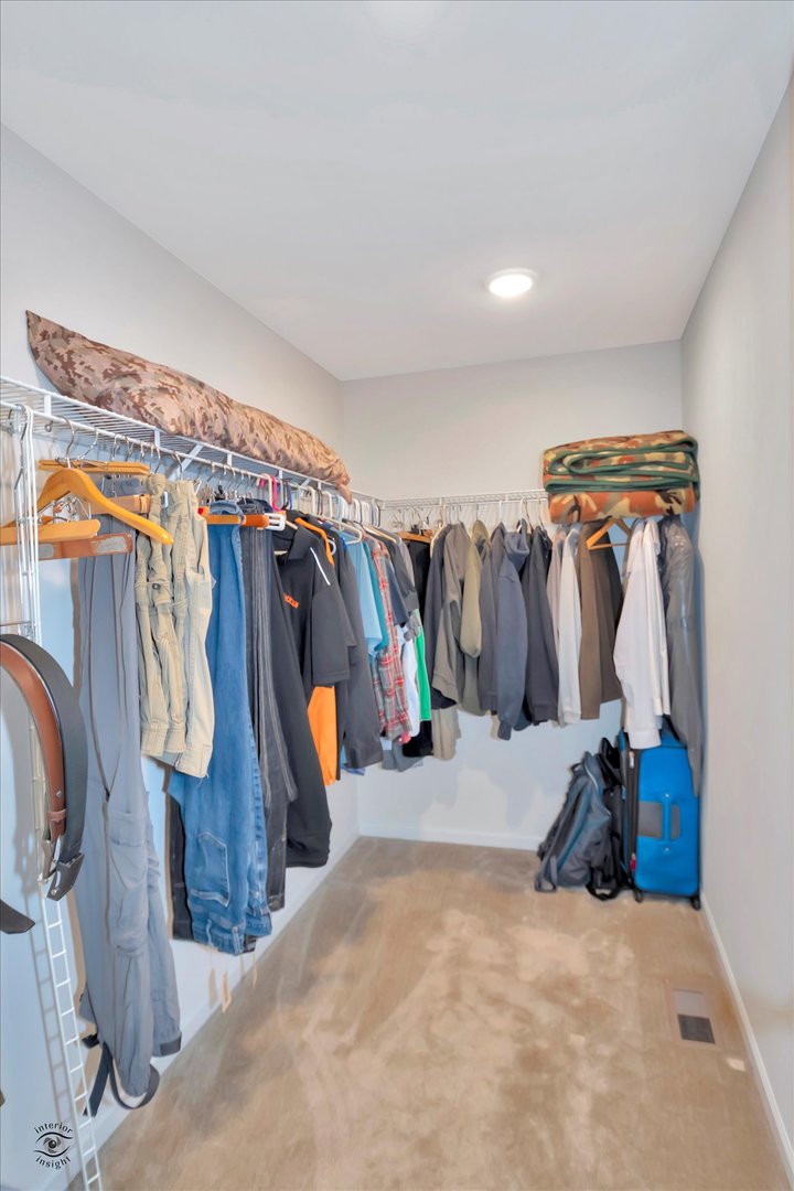 1721 Eagle Ct. Morris, IL 60450 - Photo 15 of 27 a view of walk in closet with clothes
