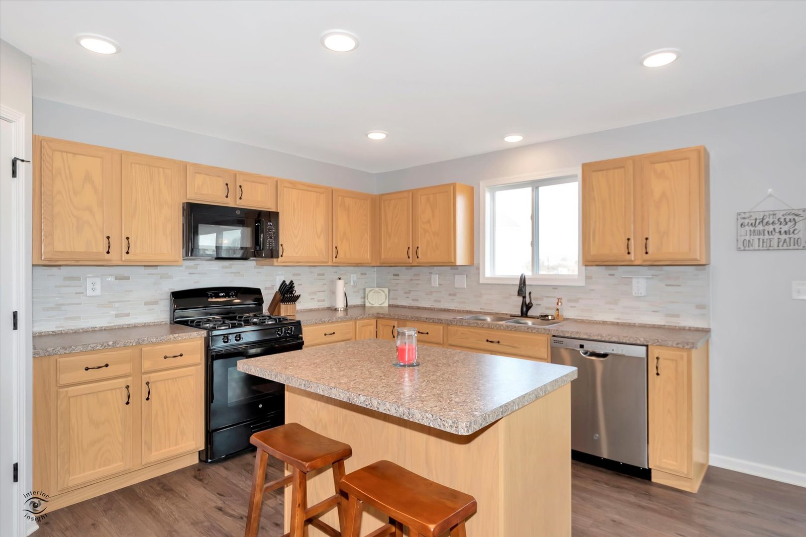 1721 Eagle Ct. Morris, IL 60450 - Photo 5 of 27 a kitchen that has a sink a stove counter space and wooden floor