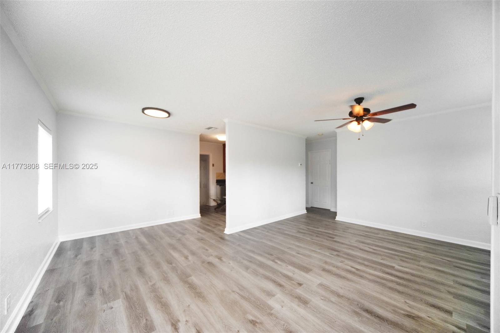 621 Hudson Road West Palm Beach, FL 33405 - Photo 2 of 27 wooden floor in an empty room