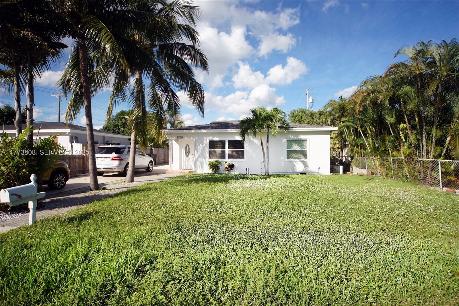621 Hudson Road West Palm Beach, FL 33405 - Photo 21 of 27 a view of a house with a backyard