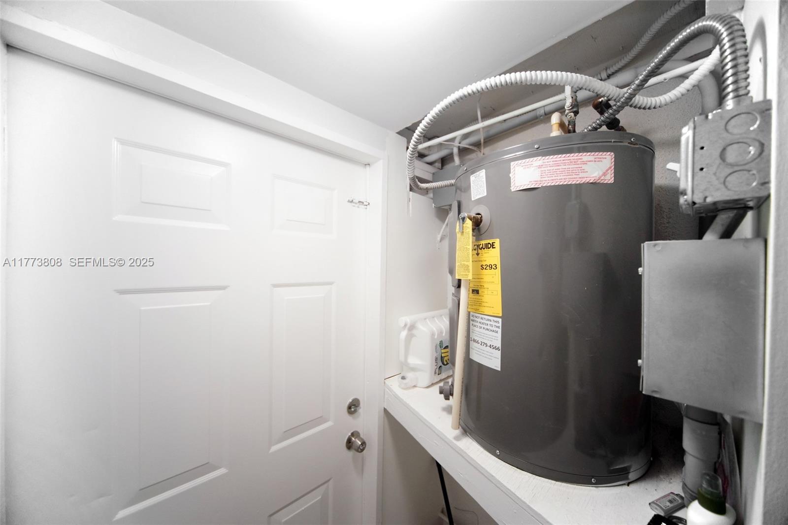 621 Hudson Road West Palm Beach, FL 33405 - Photo 27 of 27 a bathroom with a sink and mirror with bathtub
