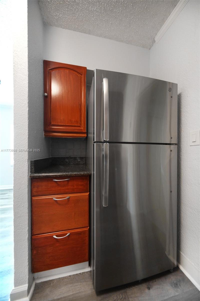 621 Hudson Road West Palm Beach, FL 33405 - Photo 7 of 27 a view of a refrigerator in a kitchen