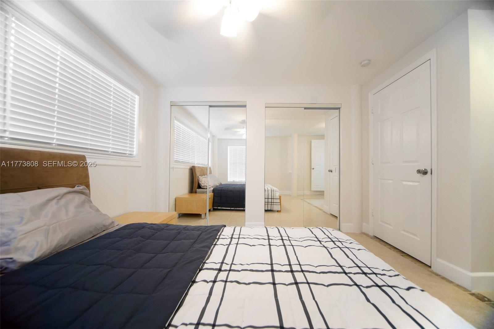 621 Hudson Road West Palm Beach, FL 33405 - Photo 9 of 27 a bedroom with a bed and a couch