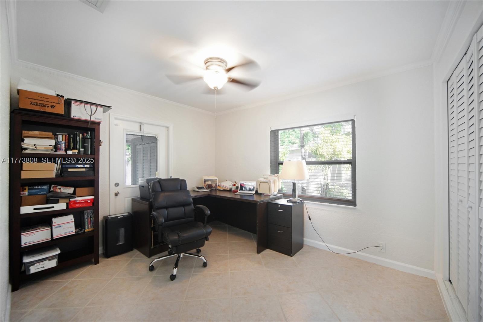 621 Hudson Road West Palm Beach, FL 33405 - Photo 10 of 27 a view of a workspace with furniture and a window