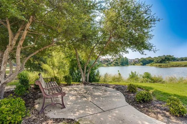 a building outdoor space with patio furniture and potted plants