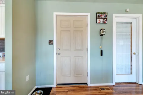 a bathroom with a bathtub and a window