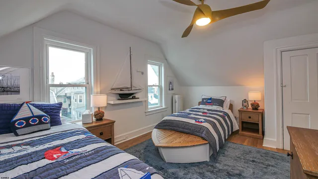 a bedroom with furniture and a window