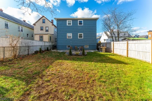 a view of a backyard with sitting area