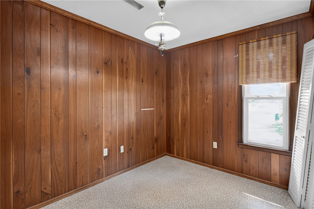 1412 Simpson Road Pendleton, SC 29670 - Photo 19 of 48 Rich wood paneling provides a warm backdrop for this intimate and versatile space.