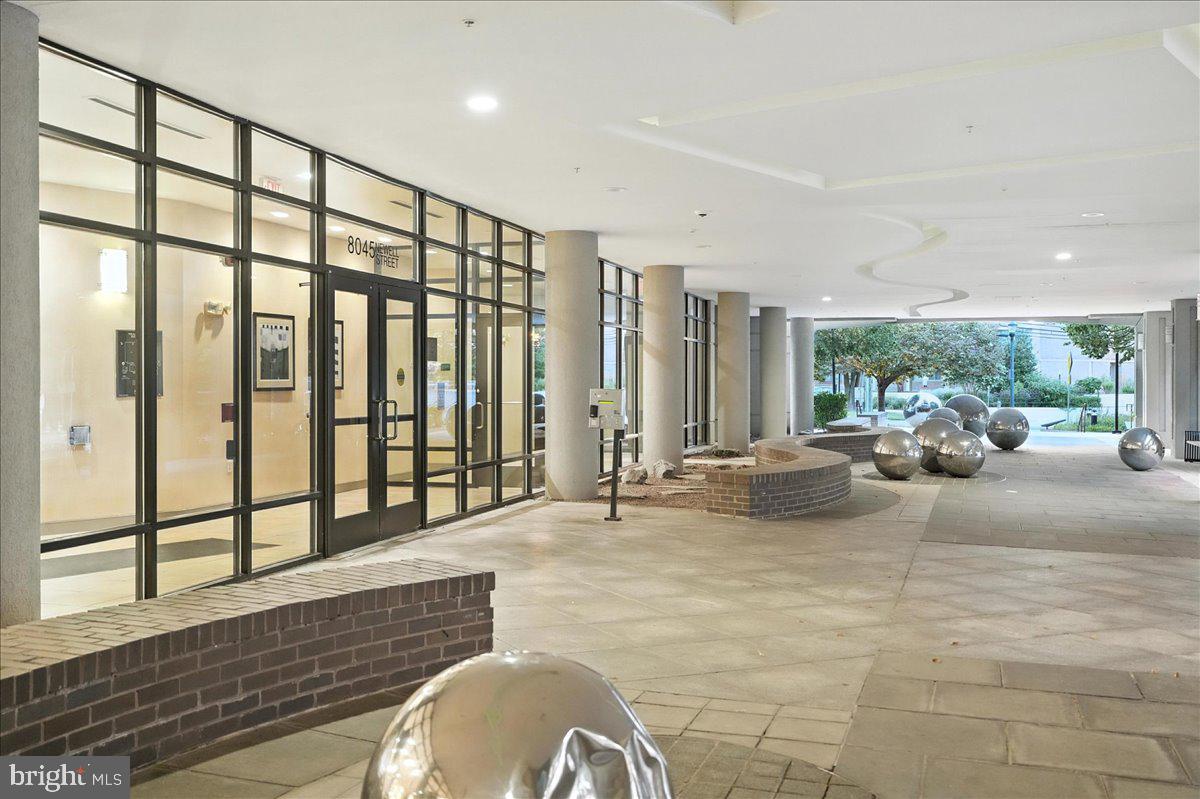 8045 Newell Street, Unit 301 Silver Spring, MD 20910 - Photo 17 of 19 a living room with furniture and a large window