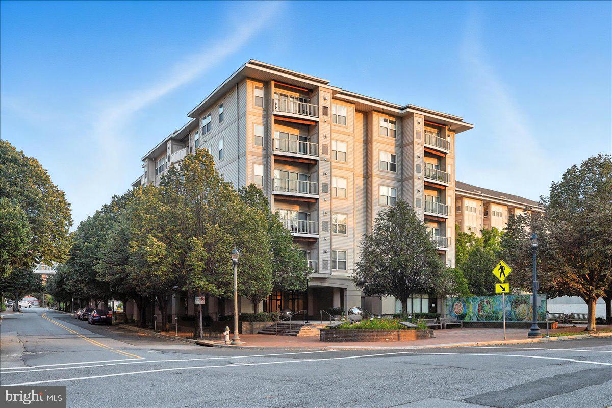 8045 Newell Street, Unit 301 Silver Spring, MD 20910 - Photo 2 of 19 a front view of a building with street view