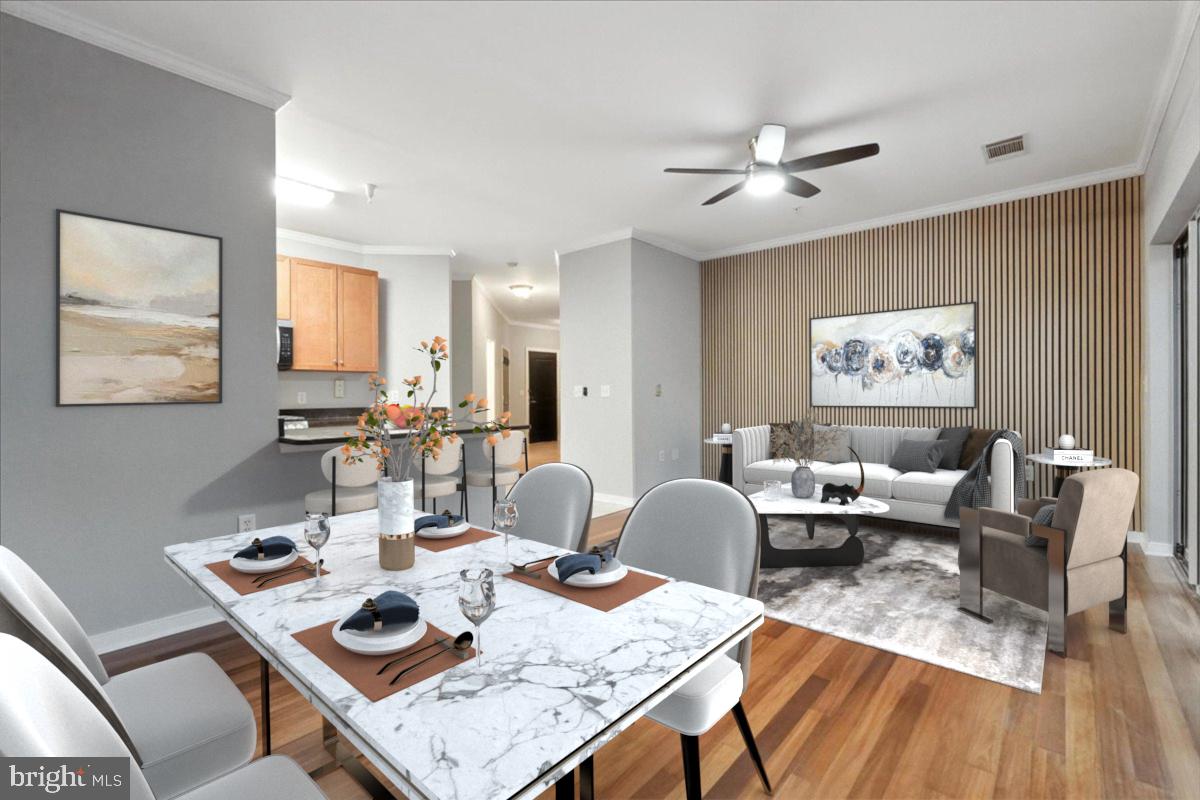 8045 Newell Street, Unit 301 Silver Spring, MD 20910 - Photo 6 of 19 a living room with furniture and wooden floor