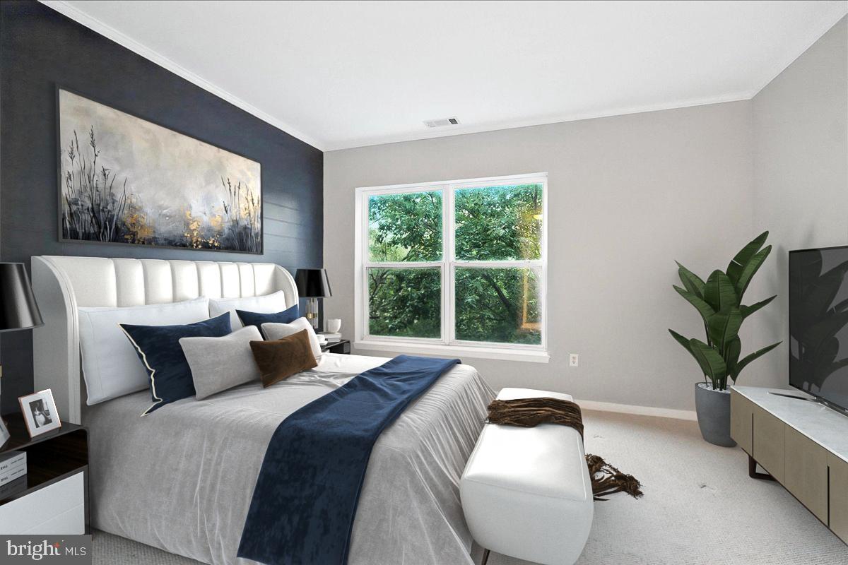 8045 Newell Street, Unit 301 Silver Spring, MD 20910 - Photo 9 of 19 a bedroom with furniture and a large window