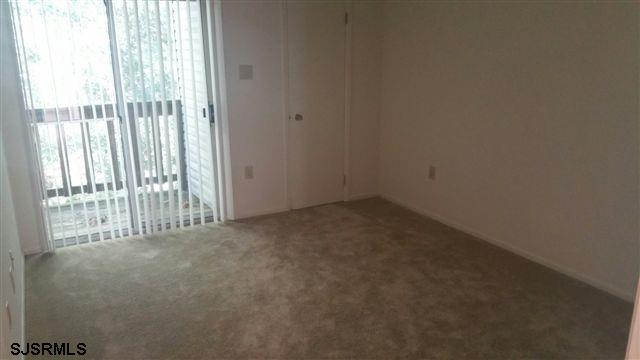 54 White Pond Court Galloway Township, NJ 08205 - Photo 12 of 13 a view of an empty room with a window