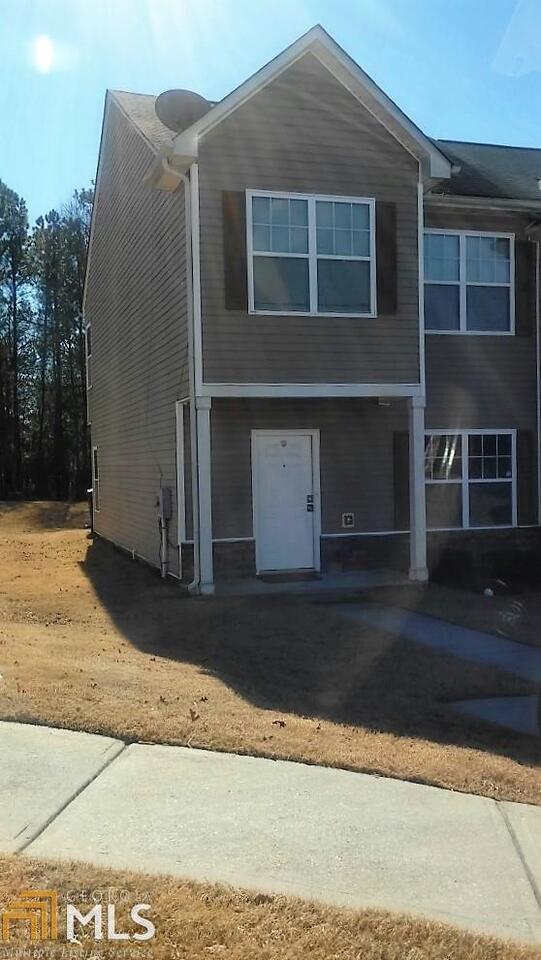 1712 Broad River Road, Unit 62 Atlanta, GA 30349 - Photo 1 of 1 a front view of a house with a yard